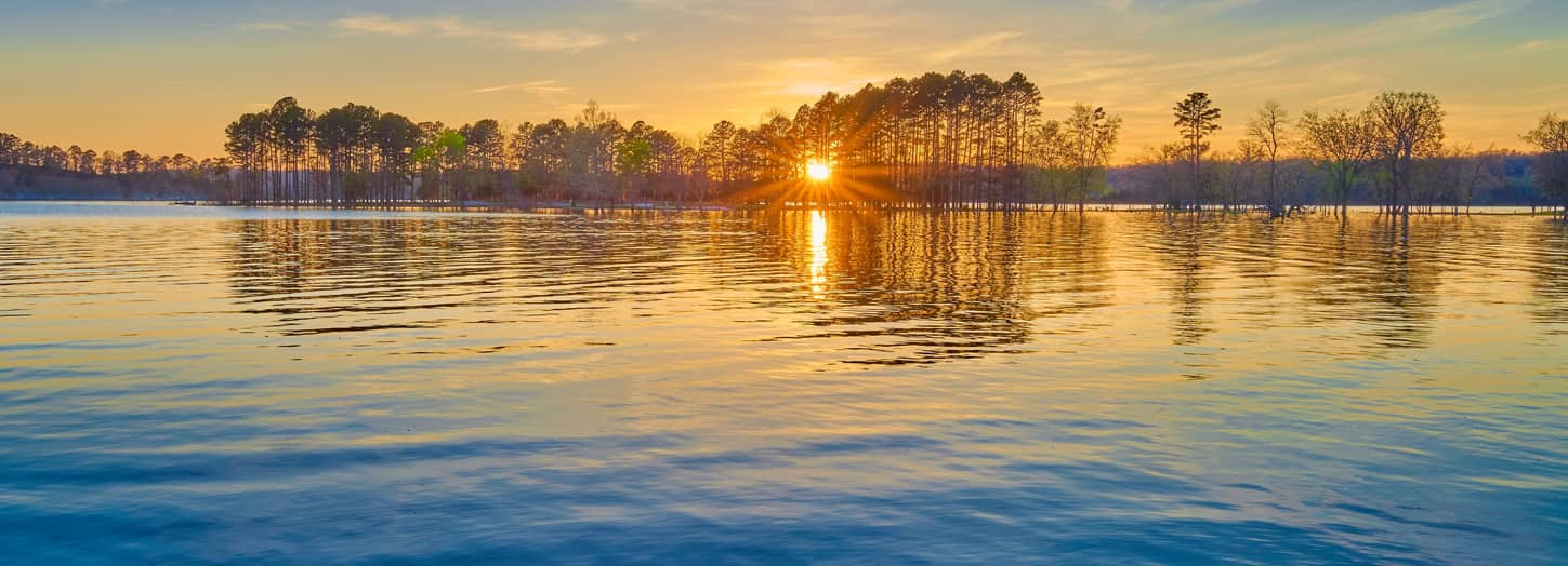 A sunset over a lake.