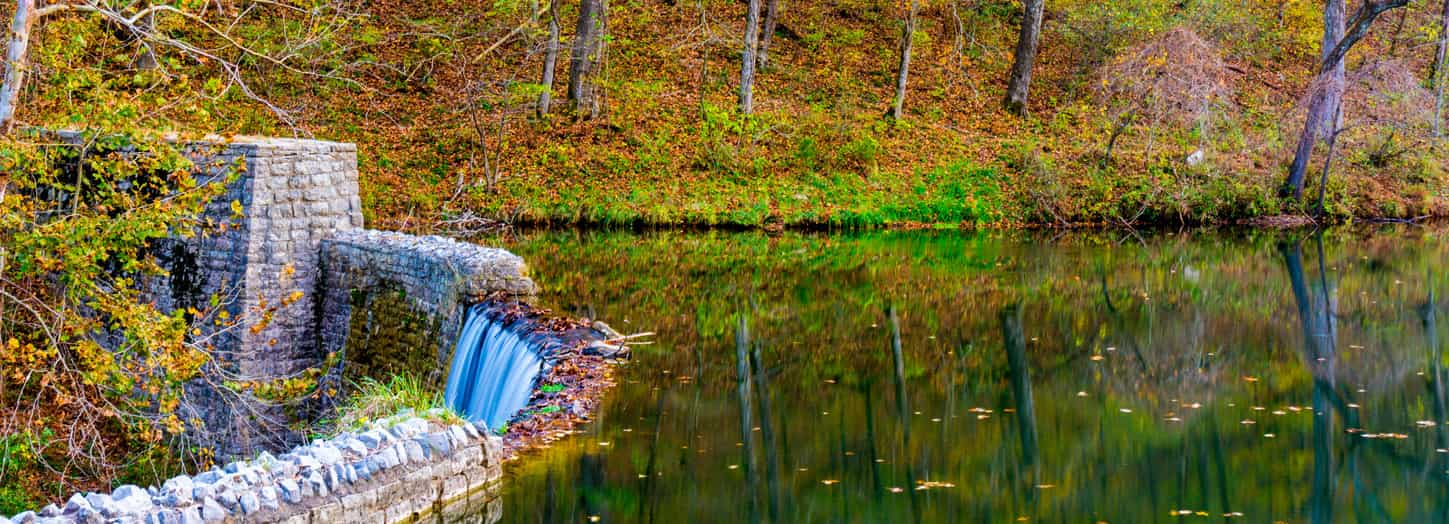 Waterfall falling off a stream in the fall of the year..