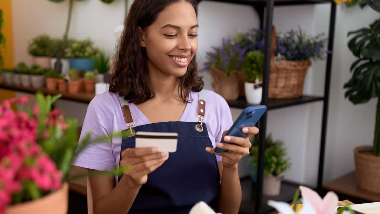 Woman using her credit card.