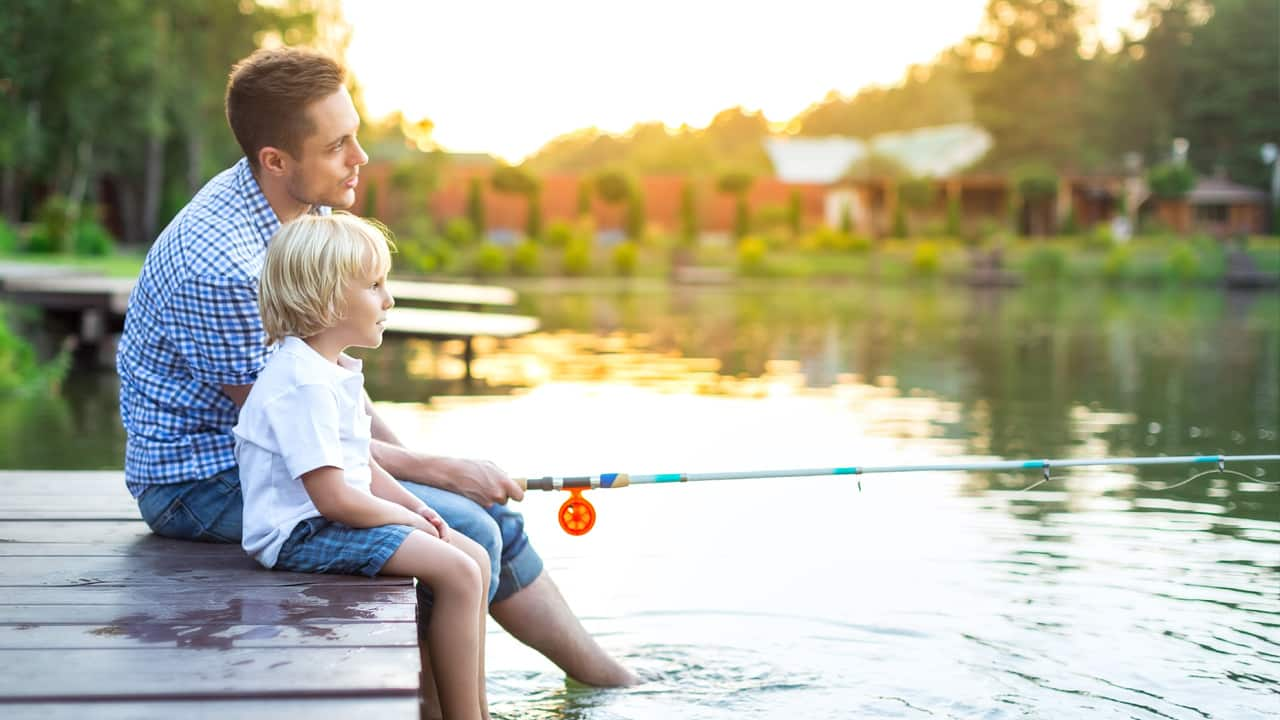 Young father fishing with his son.