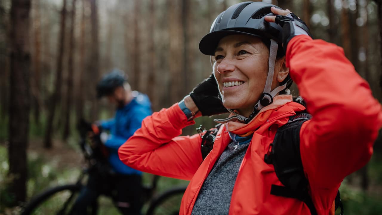 Older adult out riding mountain bikes.