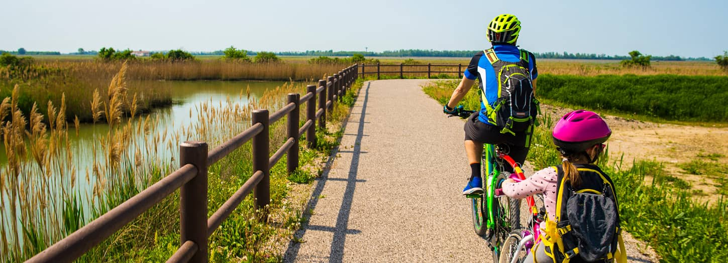 Father and daughter riding bikes